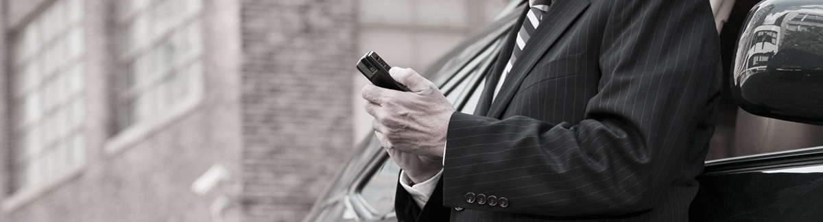 Client using the Infinity Transportation app on his smart phone